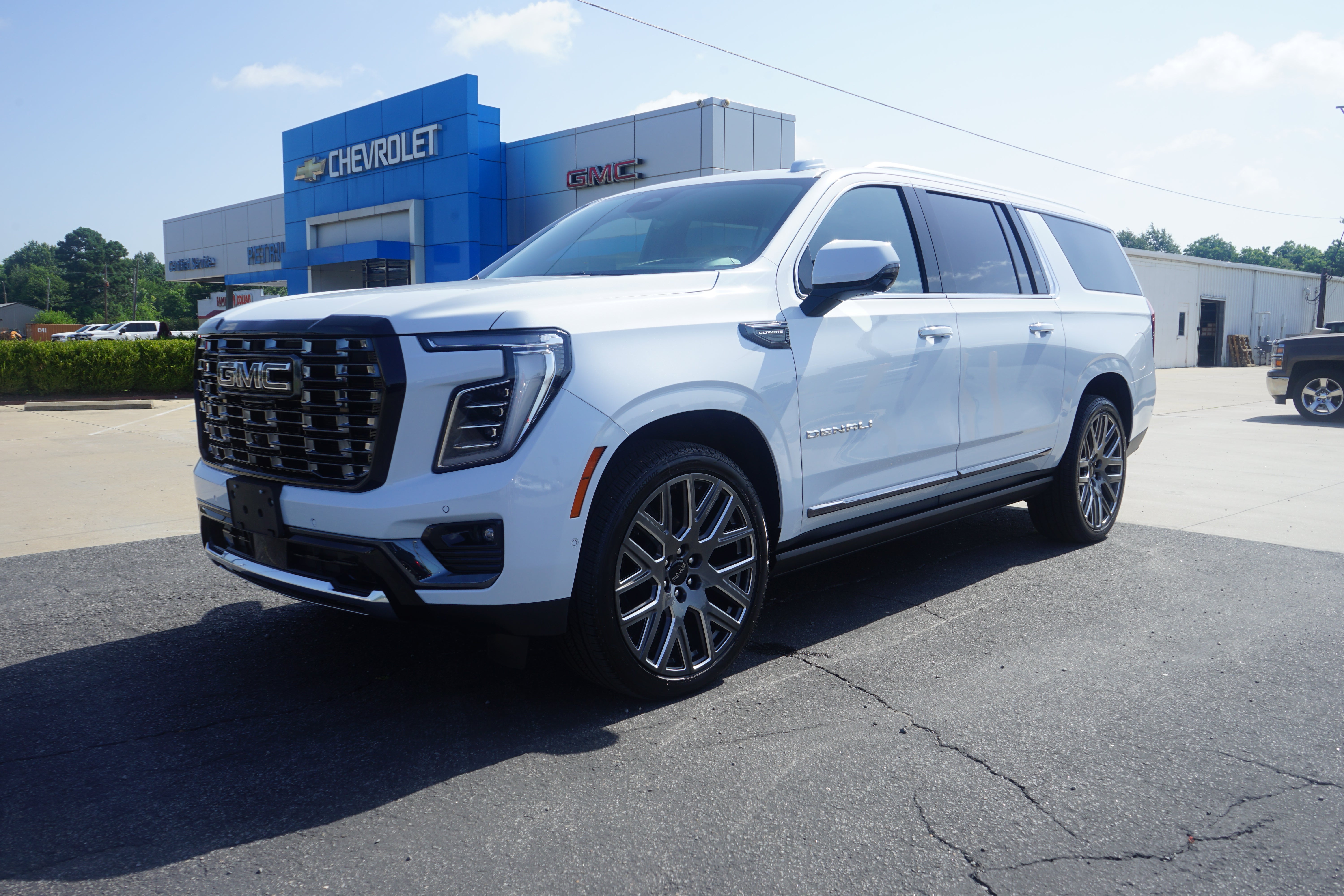 2026 GMC Yukon XL Denali Ultimate in Glacier White Tricoat — front three-quarter view