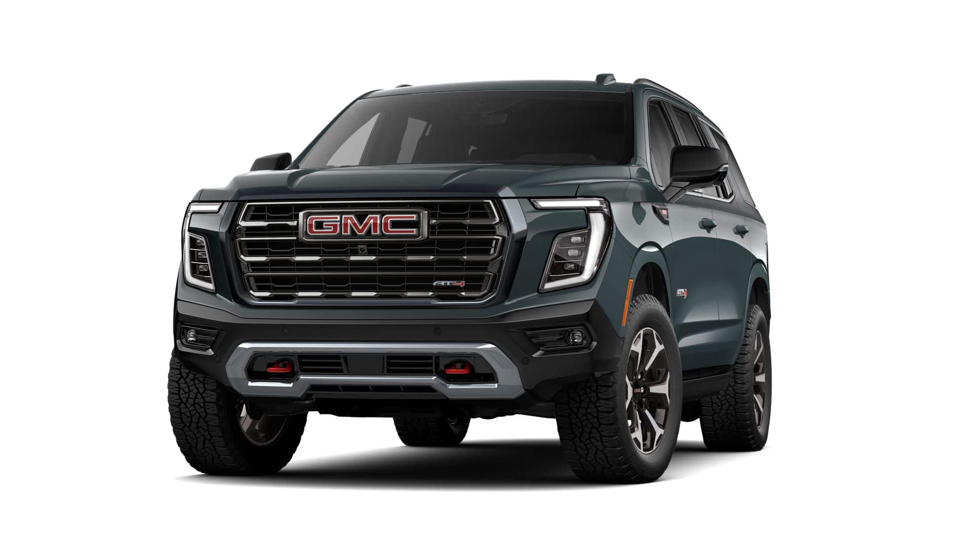 2026 GMC Yukon AT4 Ultimate in Midnight Pine — front three-quarter view