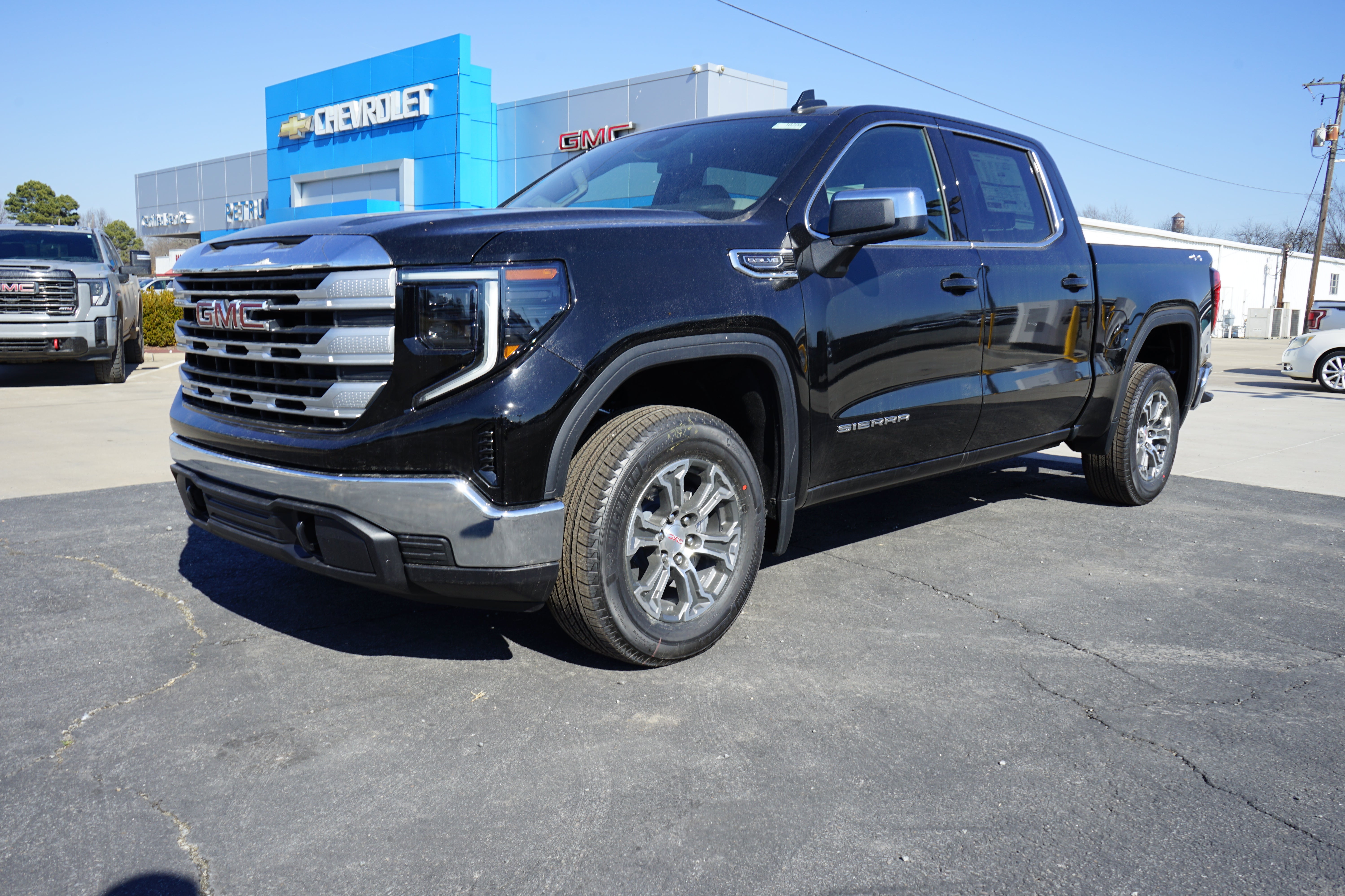 2026 GMC Sierra 1500 SLE in Onyx Black — front three-quarter view
