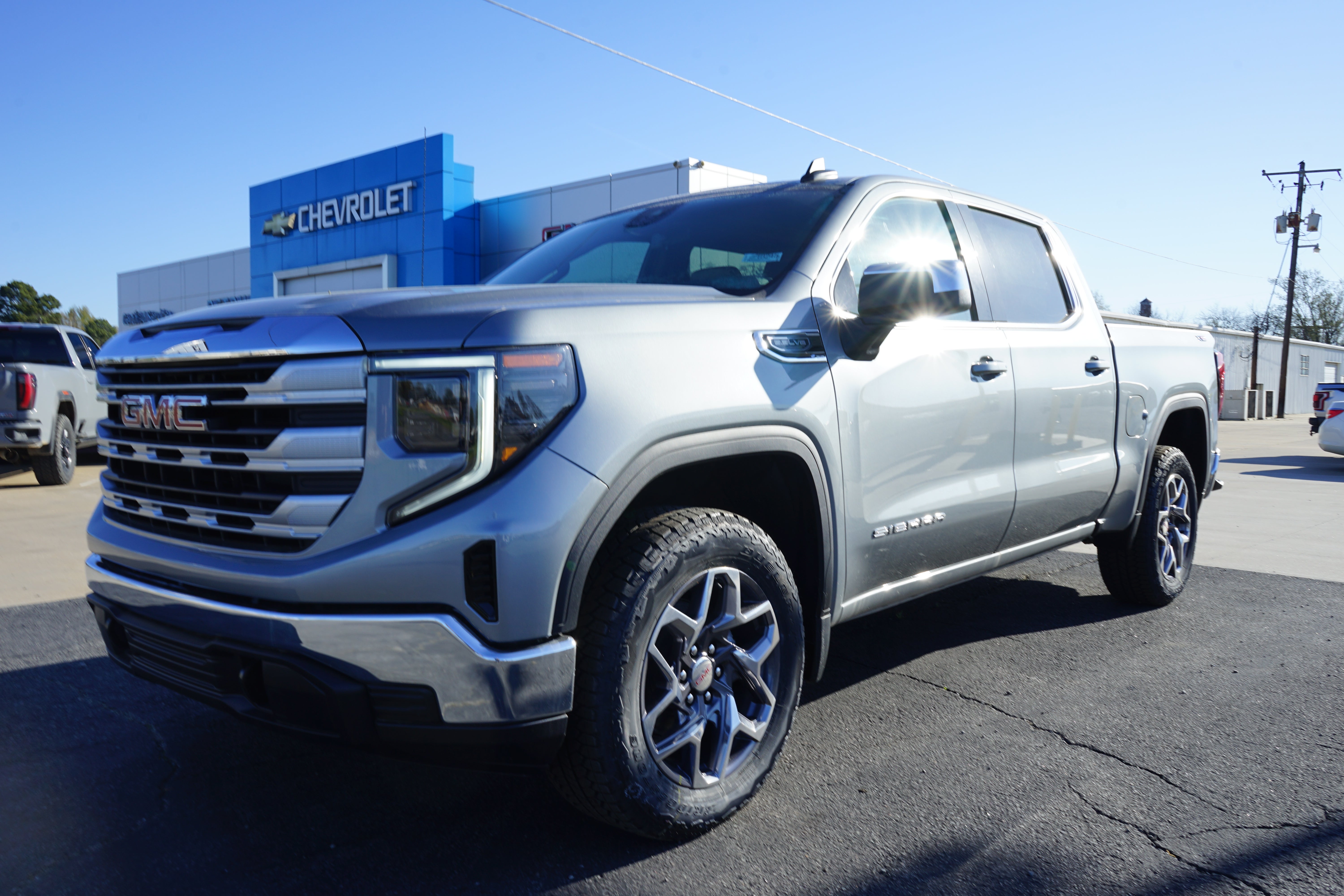 2026 GMC Sierra 1500 SLE in Sterling Metallic — front three-quarter view