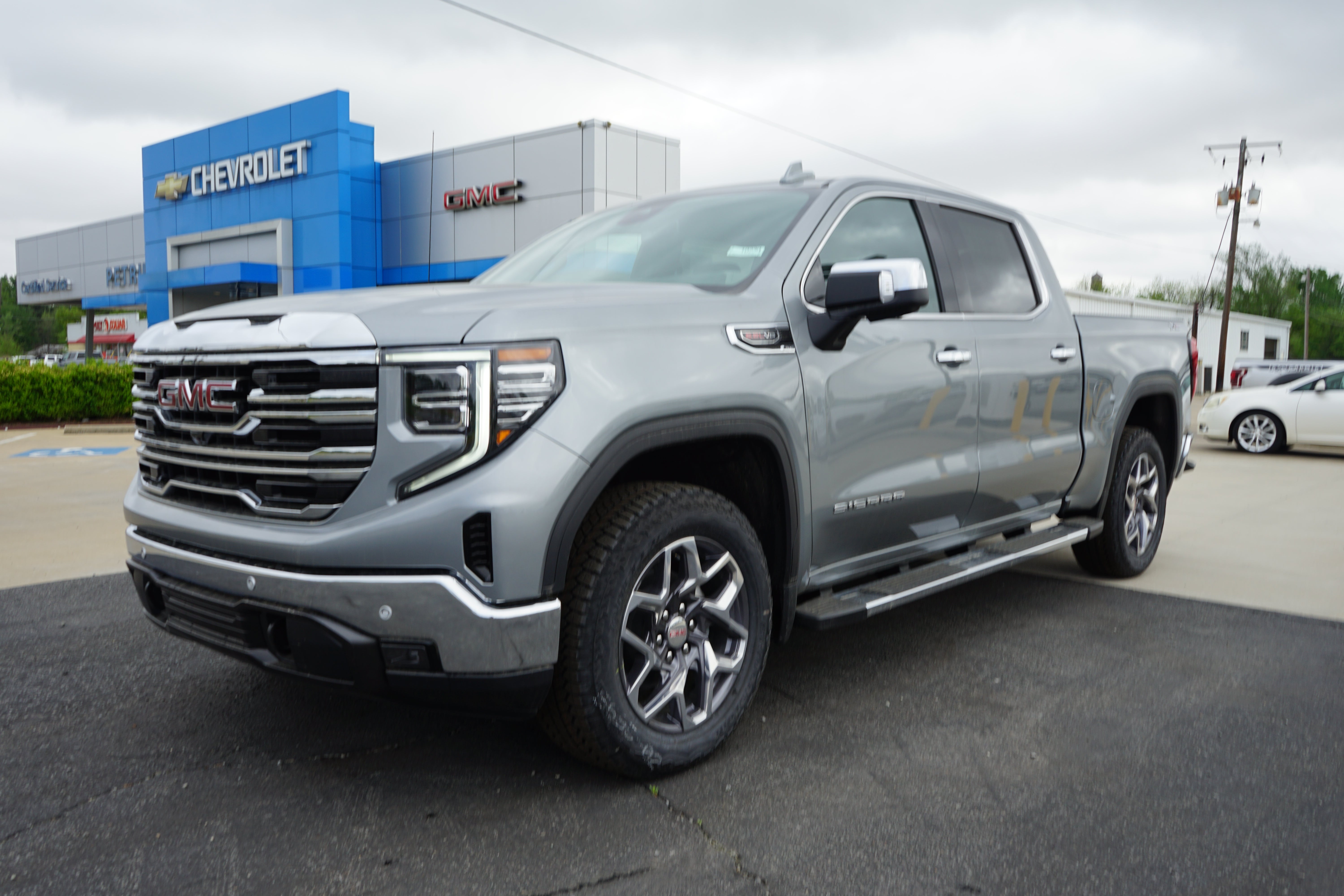 2026 GMC Sierra 1500 SLT in Sterling Metallic — front three-quarter view