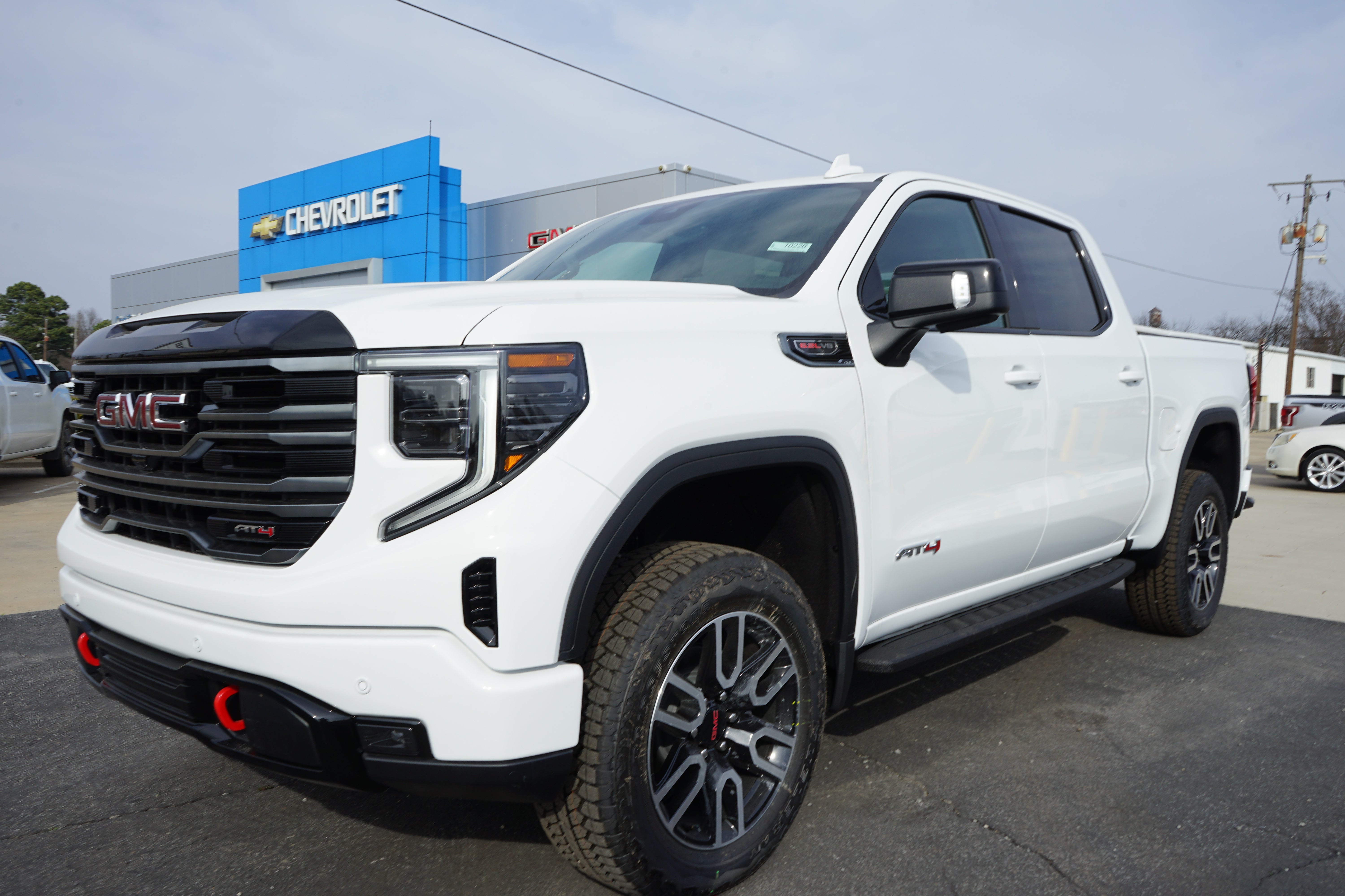 2026 GMC Sierra 1500 AT4 in Summit White — front three-quarter view