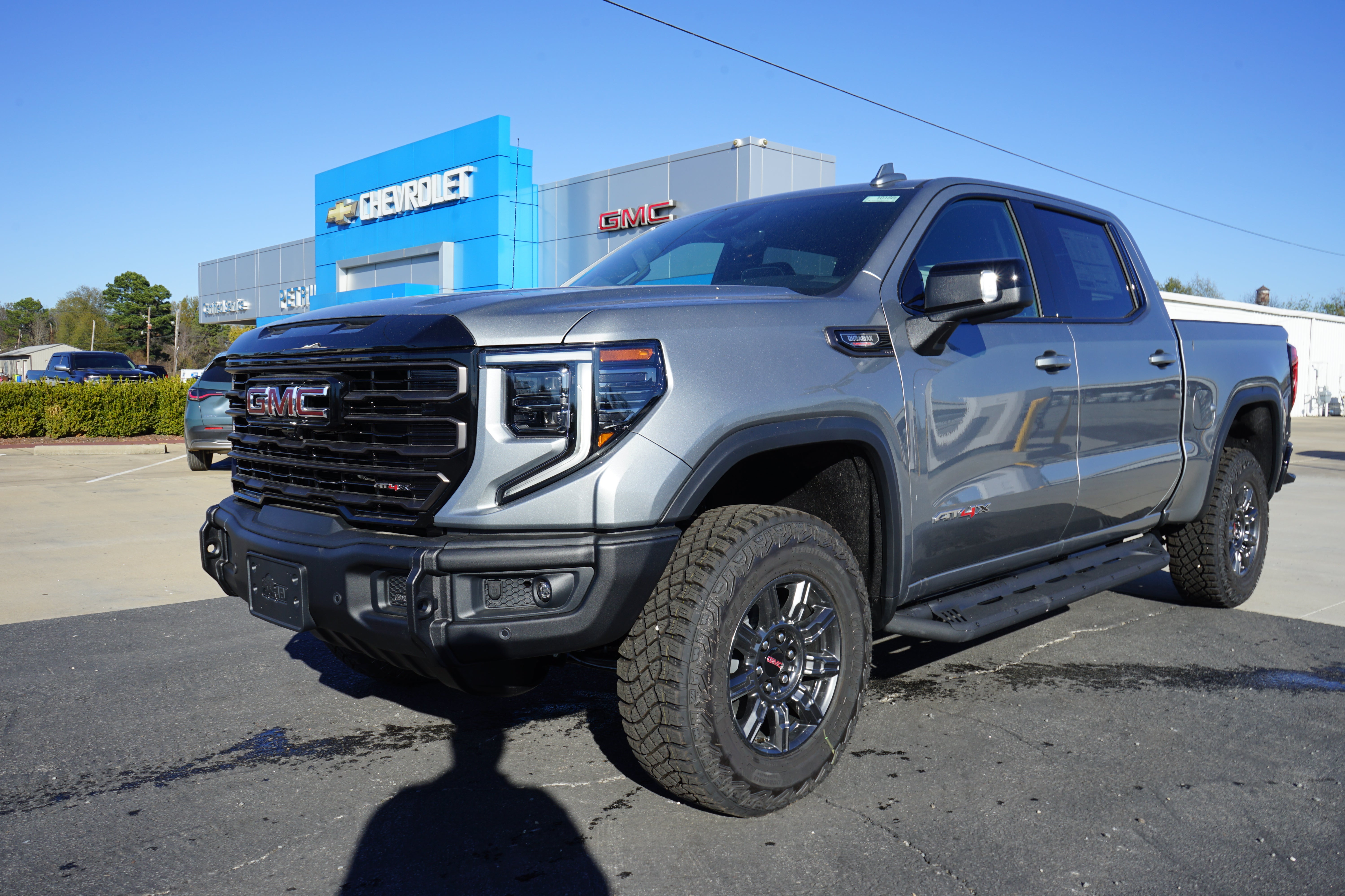 2026 GMC Sierra 1500 AT4X in Sterling Metallic — front three-quarter view